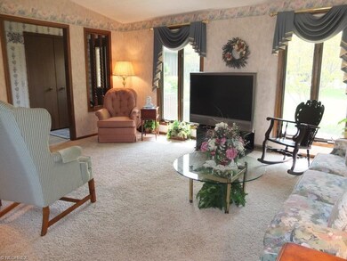 Living room with vaulted ceiling.