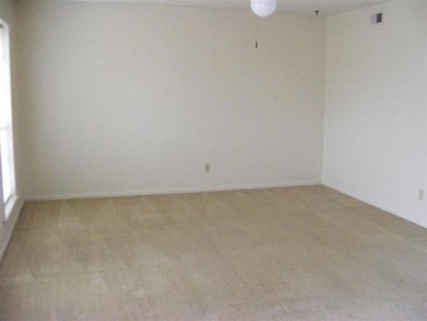 Unfurnished room featuring light carpet, a ceiling