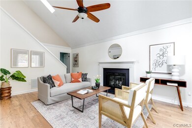 Enter into the airy living room with vaulted ceili
