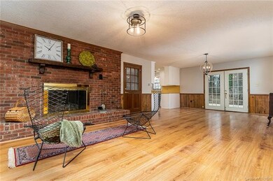great room/dining room. Updated lighting.