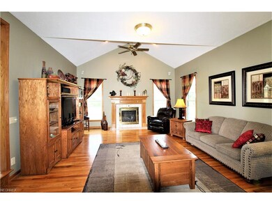 Family Room with Ceiling Fan, Hardwood Floor & Vau