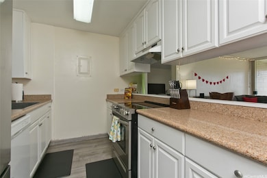 The stainless steel refrigerator is approximately