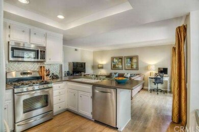 The kitchen is immaculate with recessed lighting, 