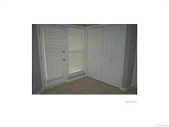 View of laundry area double doors and door to cove