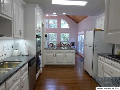 Kitchen with breakfast bar opening to the keeping 