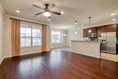 Unfurnished living room with ornamental molding, 