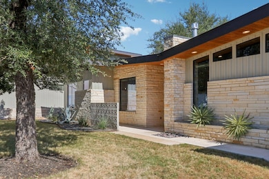 The home's sophisticated mid-century modern design is evident from every angle.