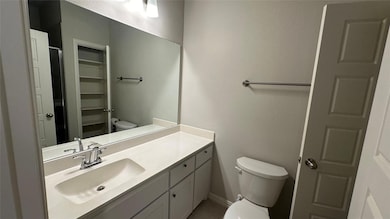 Bathroom featuring vanity and toilet