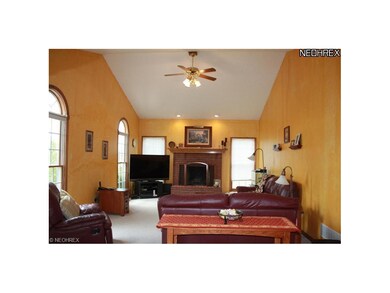 The Family room features a brick fireplace, vaulte