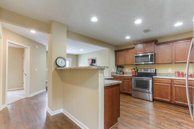 Walking into kitchen from the  living room. Nice bar!