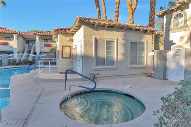 Pool with a gate, a patio, a hot tub, and fence