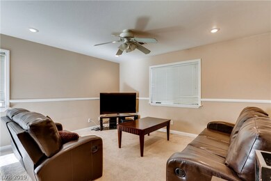 Cozy living room- plenty of natural light, track l