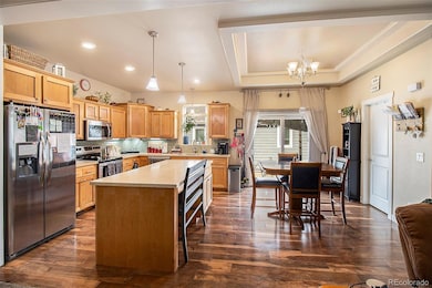 Beautiful kitchen with tons of light, a kitchen island and a pop of color backsplash.