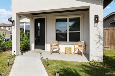 Property entrance featuring stucco siding