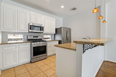 Kitchen opens up to the living room.