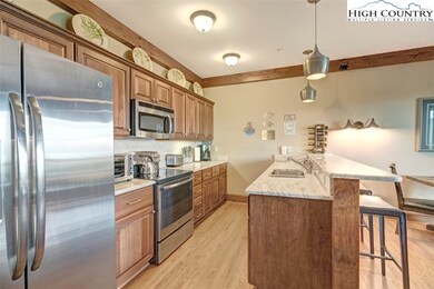 Kitchen with Custom Cabinetry and Stainless Applia