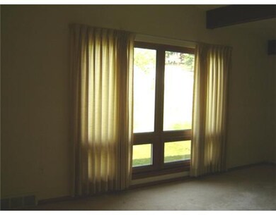 Living Room. LARGE WINDOW FEATURED IN LIVING ROOM 