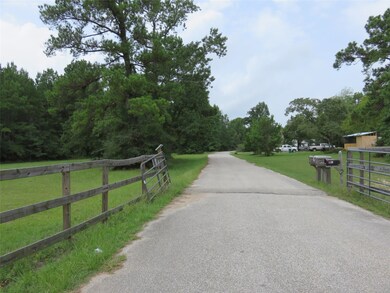 Private paved road off of Longmire Rd on the south side of property.