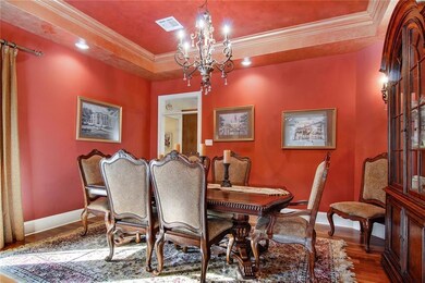 Formal Dining Room with Recessed Ceiling, wood flo