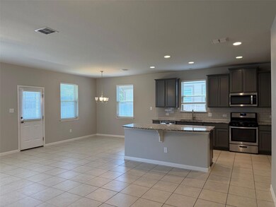 Kitchen with appliances with stainless steel fini