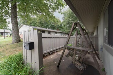 Enjoy a relaxing swing on your fenced-in patio.