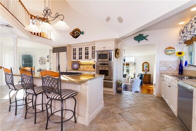 Well appointed appliances and expansive kitchen is