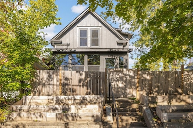 Front view highlights the home's elevated position atop the lot
