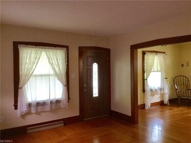 Newer Front Door, Beautiful Woodwork in Living Roo