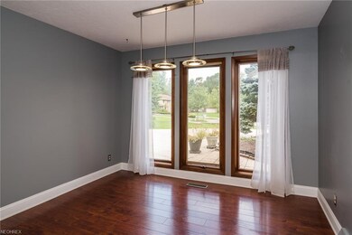 Wall of windows in the dining room offering lots o