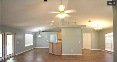 Living room, dining area and kitchen