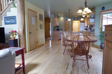 Spacious Dining Area Looking Into The Woods To The