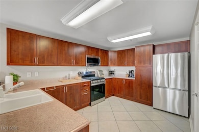 Kitchen featuring appliances with stainless steel