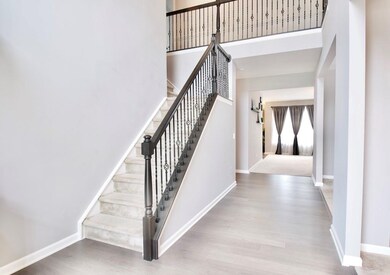 Large foyer entry and straight ahead partial view of great room. 