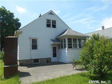 Exterior Back. BACK OF HOME FEATURES PATIO AND FIR
