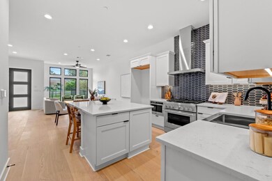 Kitchen featuring light wood-type flooring, wall 