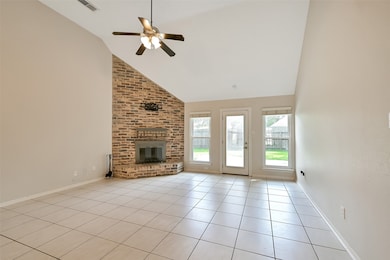 Spacious living room looks out on backyard and inc