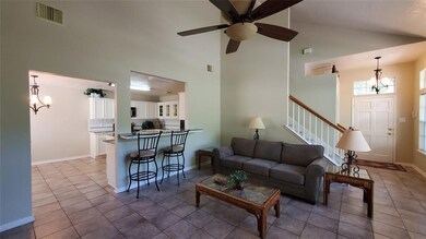 Another view of living room toward dining room and
