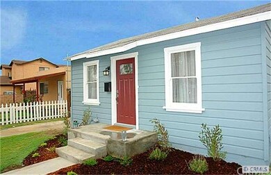 white picket fence, new landscaping