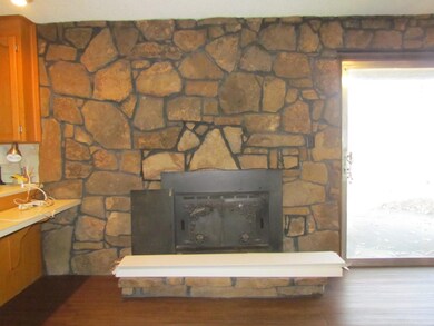 Wood burning fireplace with a gorgeous view of the farm 