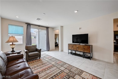 Living area with light tile patterned floors, base