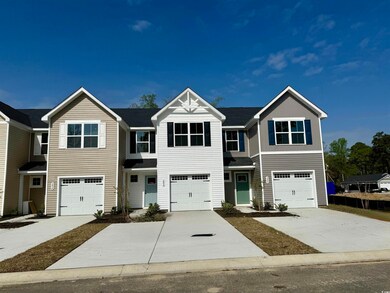 Townhome / multi-family property with driveway and