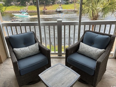 Wooden deck featuring a water view