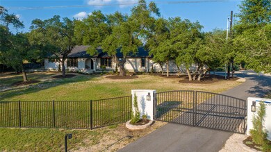 Single story home featuring a gate and covered po