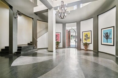 Entrance Lobby with Mail, entrance to parking garage, gym, entrance  to elevator.