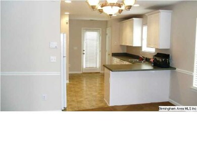 Another view of the kitchen area from the greatroo