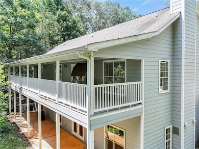 View of home's exterior with roof with shingles