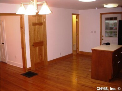 Kitchen. View of the island, closed door leads to 
