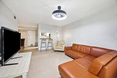 White table and two bar stools pictured all convey