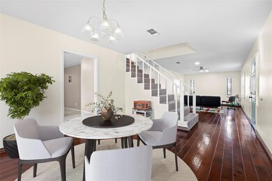 Dining space featuring visible vents, hardwood / w
