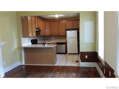 Kitchen has door to back yard.